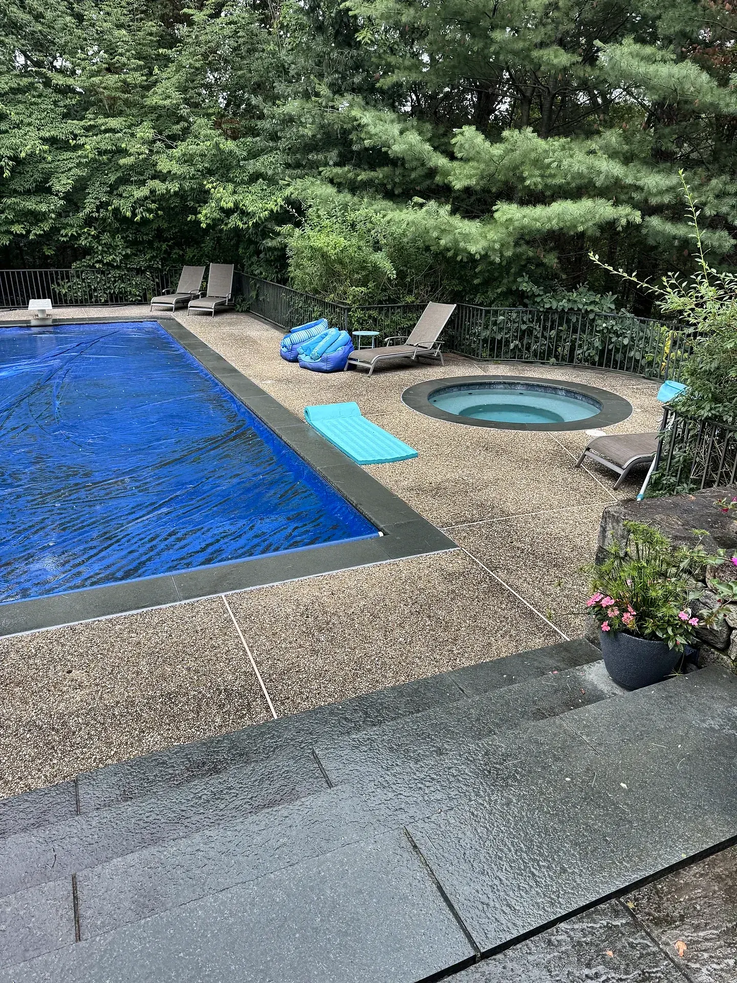 Old concrete deck around the pool and spa