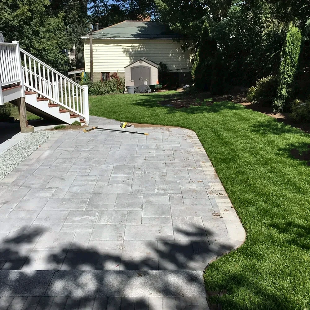 Gravel area turned into a curved paver patio by Gerrior Masonry