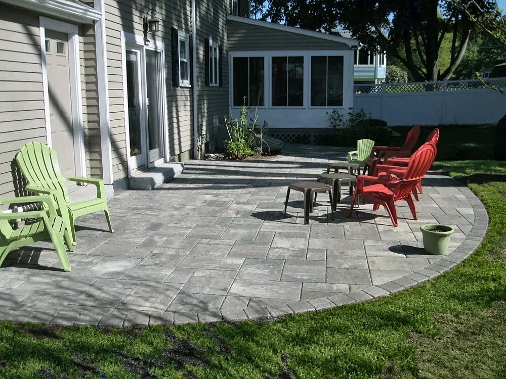 Raised paver patio off the back doors by Gerrior Masonry