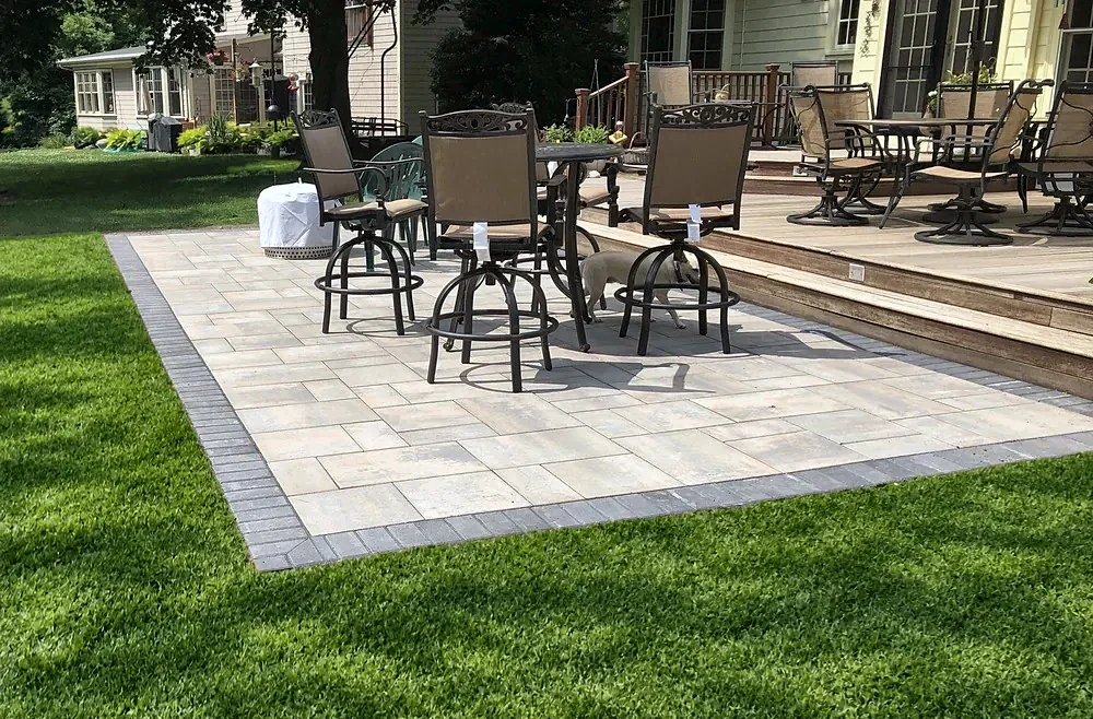 Backyard paver patio by the woods by Gerrior Masonry