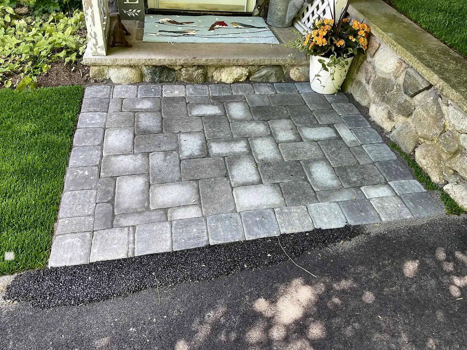Front steps with a flagstone landing by Gerrior Masonry