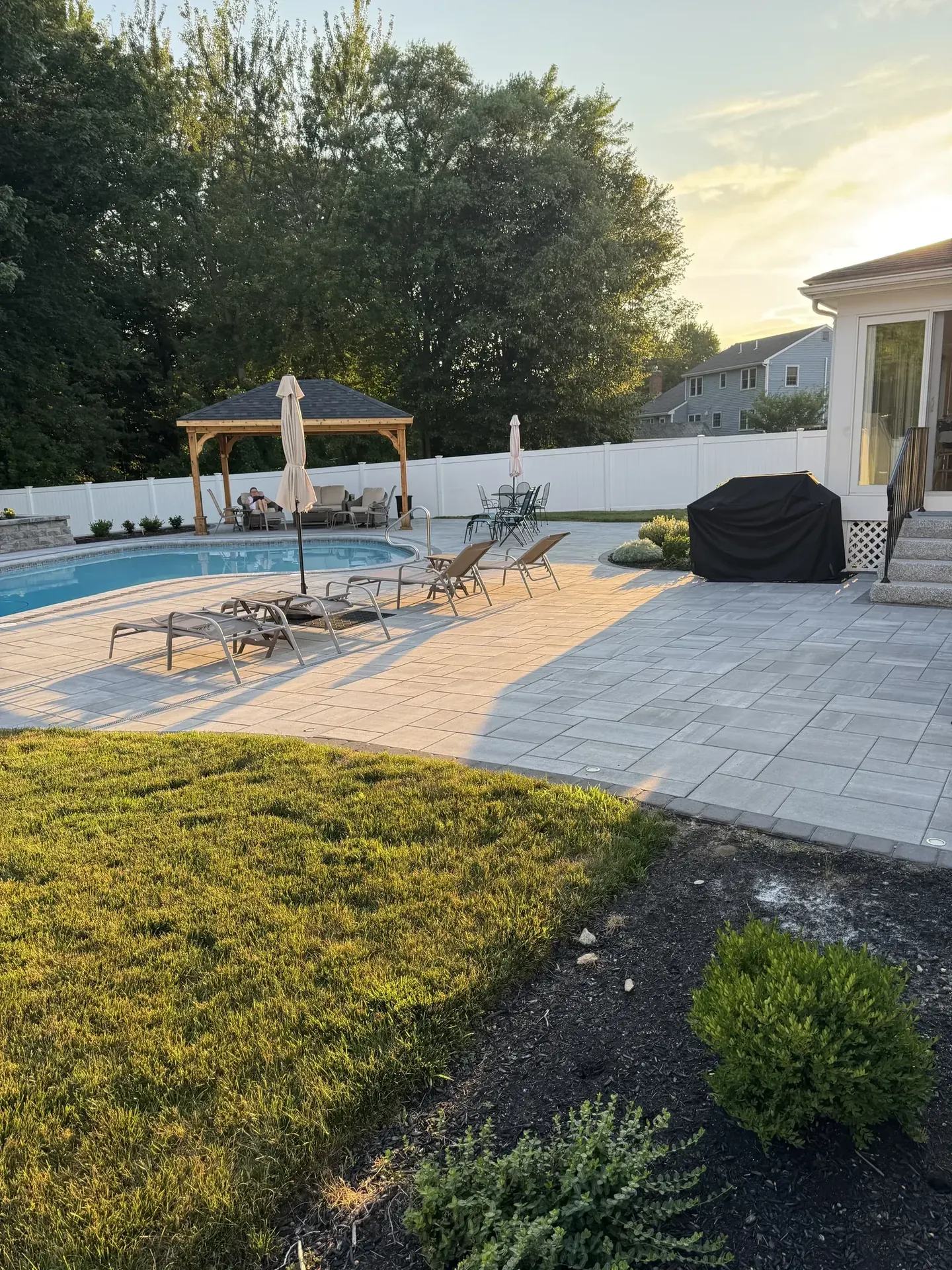 Reading, MA pool patio and pavilion at dusk