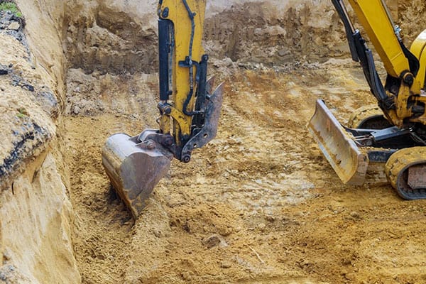 Choosing Your Drainage Hero: Dry Well or French Drain?